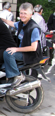 Joyce checking out a motorcycle in Lhasa, Tibet